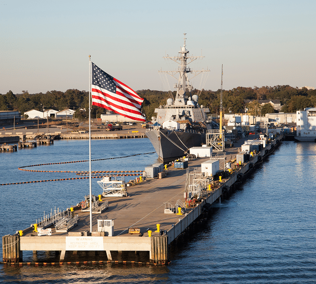 A marine base with a boat and US flag
