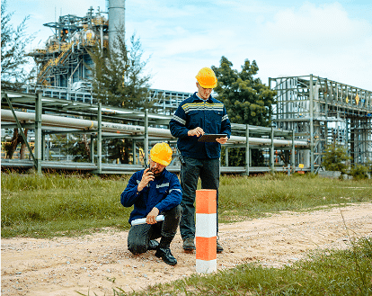 two worker outside wearing hard hats