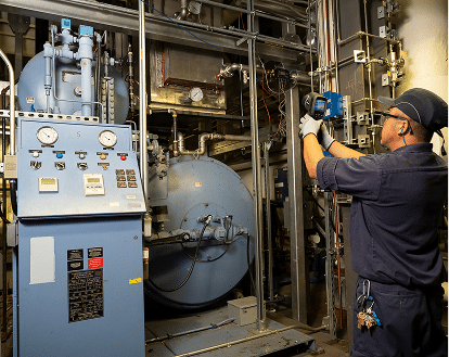 A man working in an engine room